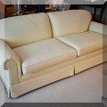F06. Cream colored sofa. 30”h x 79”w x 38”d 